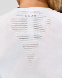 Woman wearing AeroFLX+ Seamless Long Sleeve Tee - White/White | Model:Issy | Size:XS | Thumbnail Index: 9