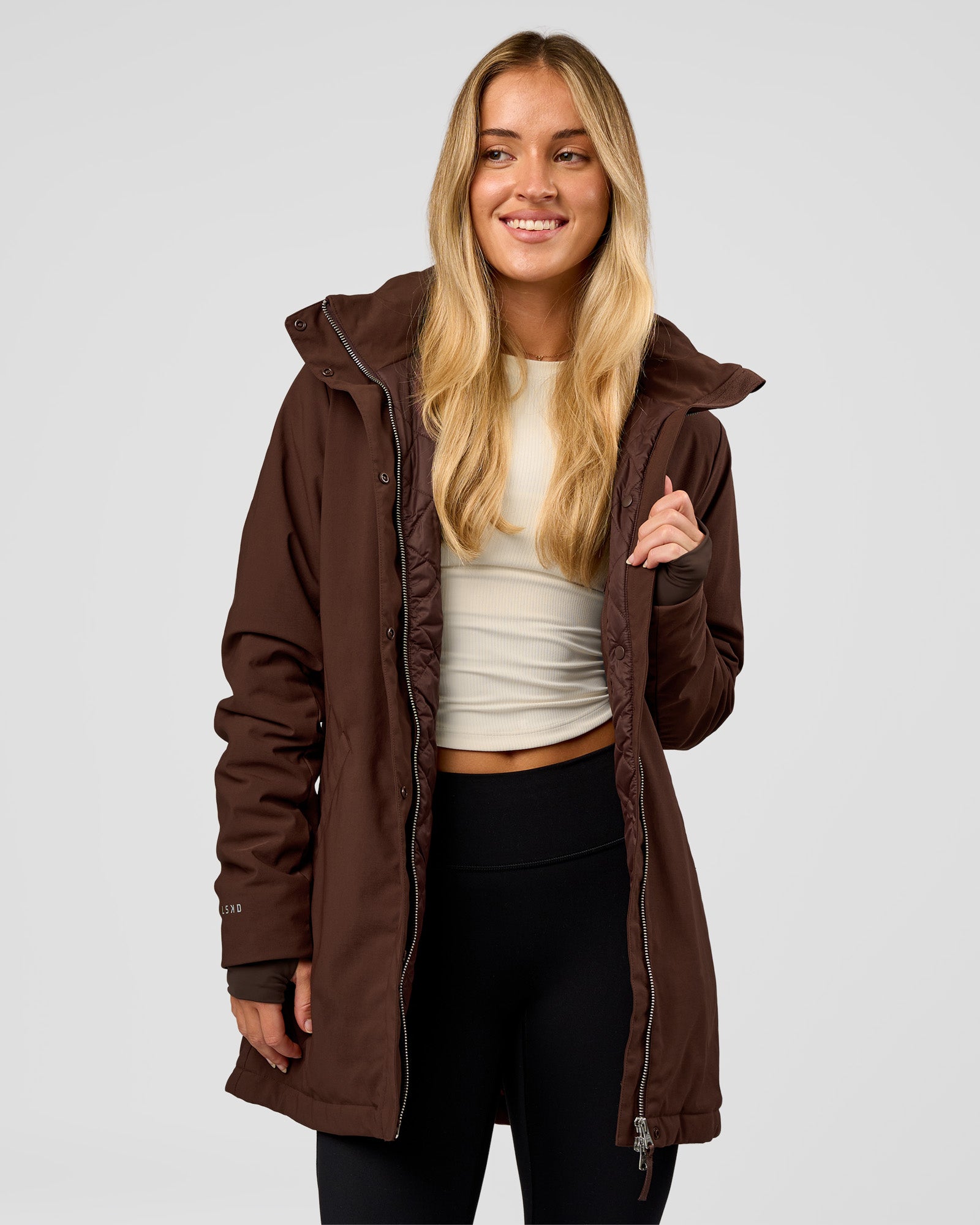 Woman wearing Auxiliary 2.0 Longline Jacket - Hot Chocolate | Model:Issy | Size:XS