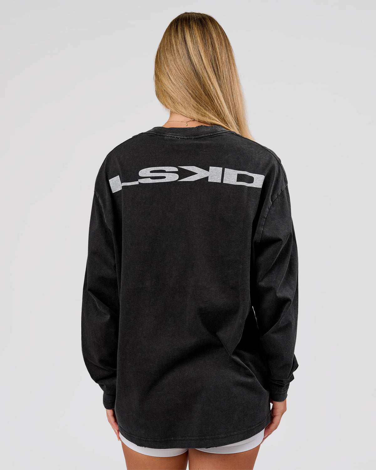 Woman wearing Backline Washed Heavyweight Oversized LS Tee - Black Washed | Model:Issy | Size:XS - view 2