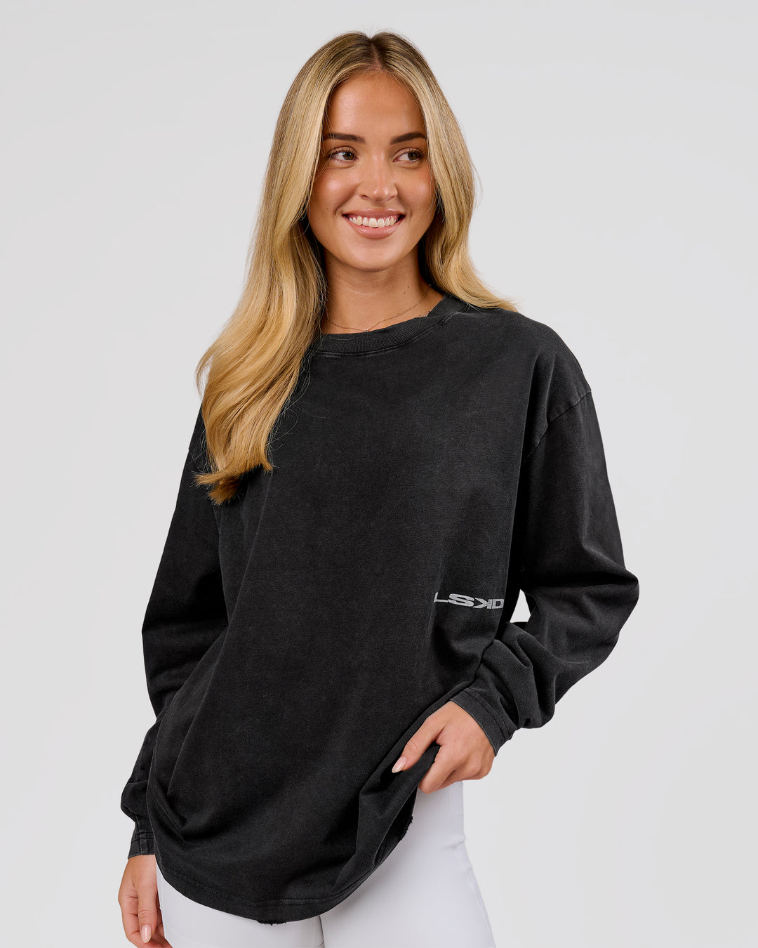 Woman wearing Backline Washed Heavyweight Oversized LS Tee - Black Washed | Model:Issy | Size:XS - view 4