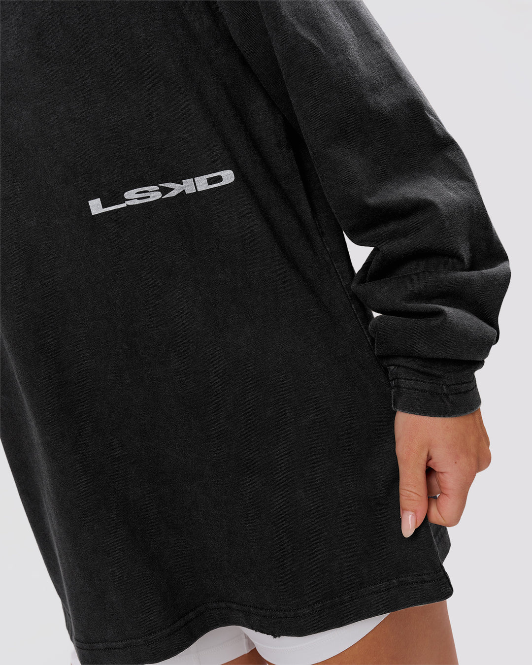 Woman wearing Backline Washed Heavyweight Oversized LS Tee - Black Washed | Model:Issy | Size:XS - view 14