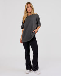 Woman wearing Backline Washed Heavyweight Oversized Tee - Asphalt Washed | Model:Issy | Size:XS | Thumbnail Index: 3