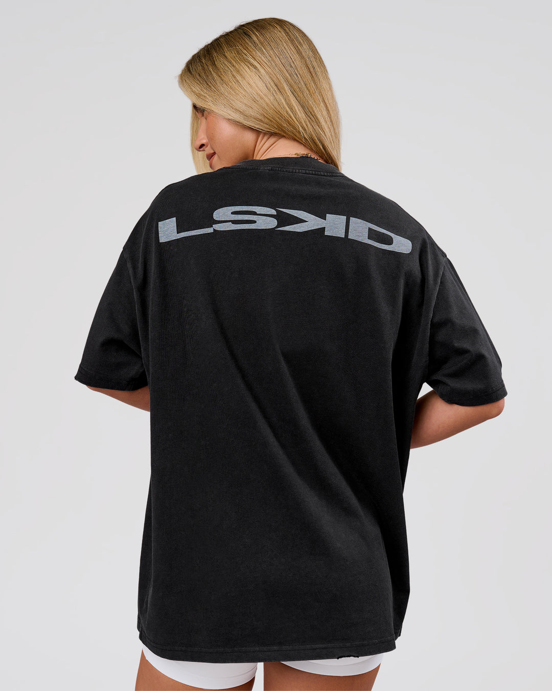 Woman wearing Backline Washed Heavyweight Oversized Tee - Black Washed | Model:Issy | Size:XS - view 2