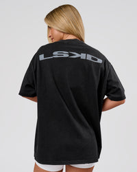 Woman wearing Backline Washed Heavyweight Oversized Tee - Black Washed | Model:Issy | Size:XS | Thumbnail Index: 1