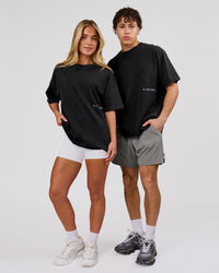 Woman wearing Backline Washed Heavyweight Oversized Tee - Black Washed | Model:Issy | Size:XS | Thumbnail Index: 8