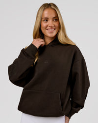 Woman wearing Base Oversized Hoodie - Ground Coffee | Model:Issy | Size:XS | Thumbnail Index: 9