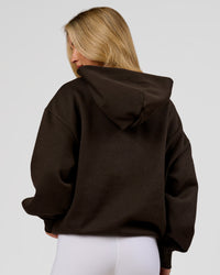Woman wearing Base Oversized Hoodie - Ground Coffee | Model:Issy | Size:XS | Thumbnail Index: 10