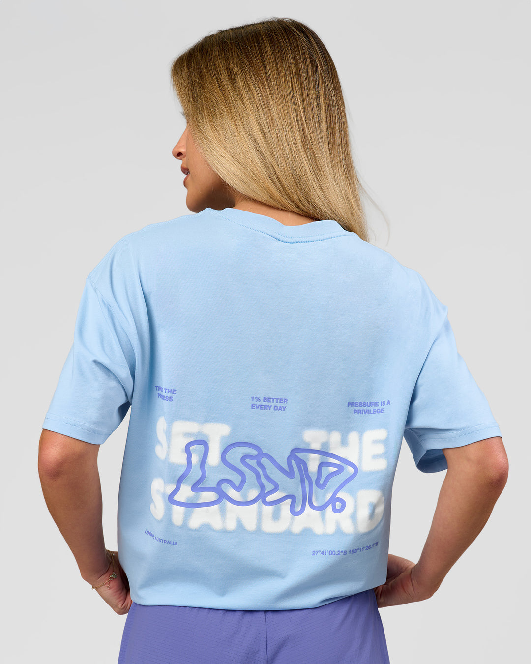Woman wearing Benchmark FLXCotton Oversized Tee - Open Air-Blue Bell | Model:Issy | Size:XS