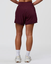 Woman wearing Challenger 5" Lined Performance Short - Cherry Lacquer | Model:Issy | Size:XS | Thumbnail Index: 3