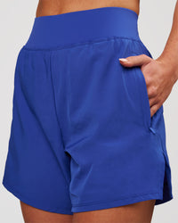 Woman wearing Challenger 5" Lined Performance Short - Power Cobalt | Model:Issy | Size:XS | Thumbnail Index: 1