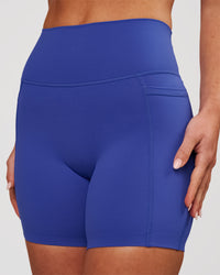 Woman wearing Elixir High-Rise 6" Short Pockets - Power Cobalt | Model:Issy | Size:XS | Thumbnail Index: 2