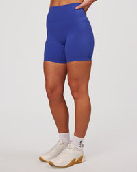 Woman wearing Elixir High-Rise 6" Short Pockets - Power Cobalt | Model:Issy | Size:XS | Thumbnail Index: 5