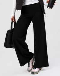 Woman wearing Elixir High-Rise Petite Pant - Black | Model:Issy | Size:XS | Thumbnail Index: 7