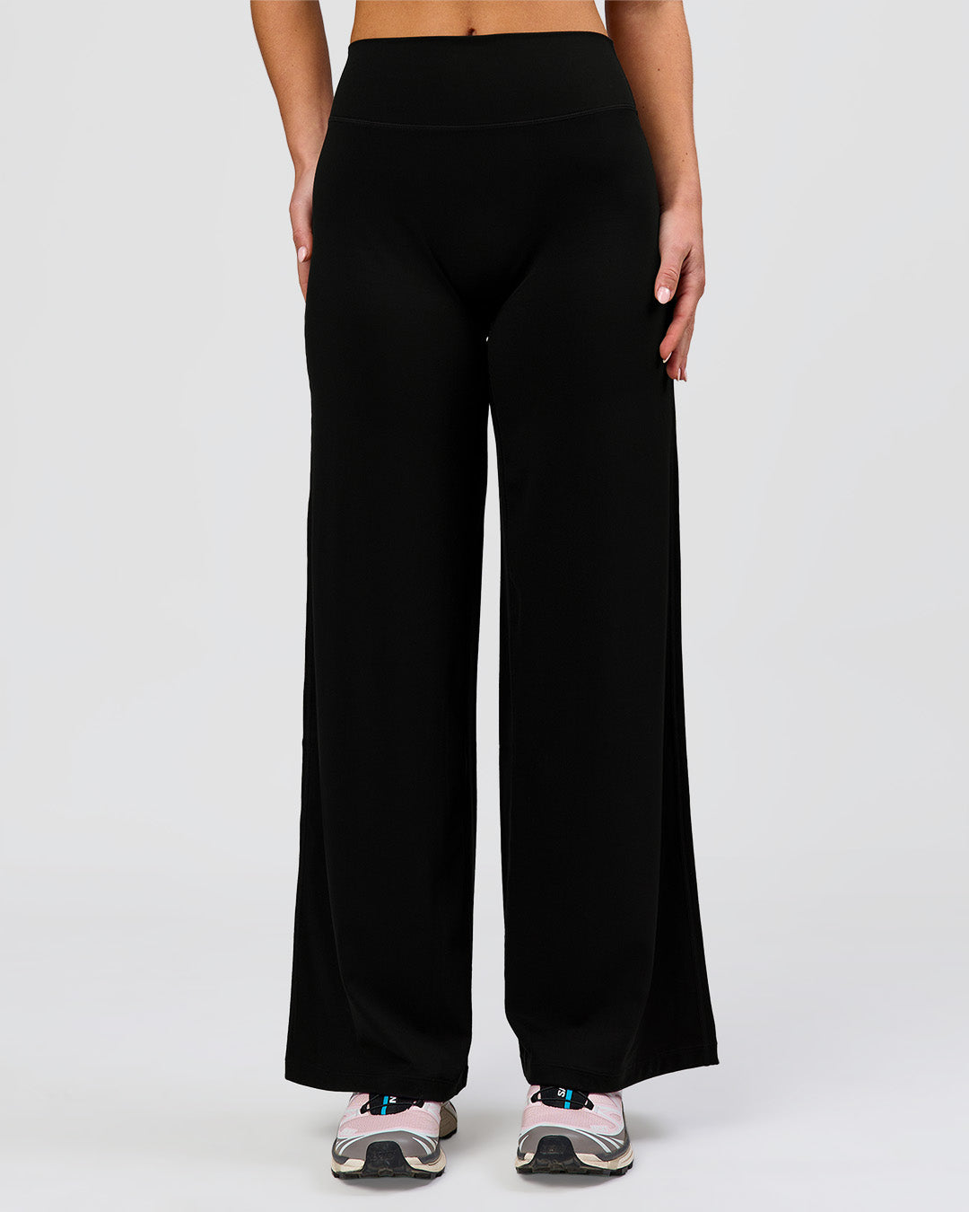 Woman wearing Elixir High-Rise Petite Pant - Black | Model:Issy | Size:XS - view 2