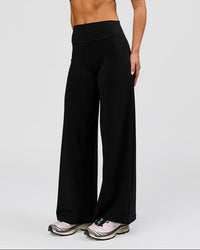 Woman wearing Elixir High-Rise Petite Pant - Black | Model:Issy | Size:XS | Thumbnail Index: 3