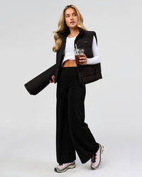 Woman wearing Elixir High-Rise Petite Pant - Black | Model:Issy | Size:XS | Thumbnail Index: 9