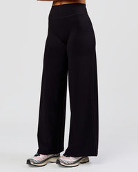 Woman wearing Elixir High-Rise Petite Pant - Black | Model:Issy | Size:XS | Thumbnail Index: 10