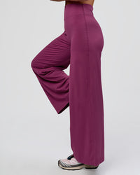 Woman wearing Elixir High-Rise Petite Pant - Boysenberry | Model:Issy | Size:XS | Thumbnail Index: 5