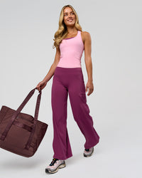 Woman wearing Elixir High-Rise Petite Pant - Boysenberry | Model:Issy | Size:XS | Thumbnail Index: 6