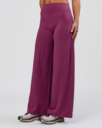 Woman wearing Elixir High-Rise Petite Pant - Boysenberry | Model:Issy | Size:XS | Thumbnail Index: 11