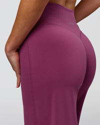 Woman wearing Elixir High-Rise Petite Pant - Boysenberry | Model:Issy | Size:XS | Thumbnail Index: 12