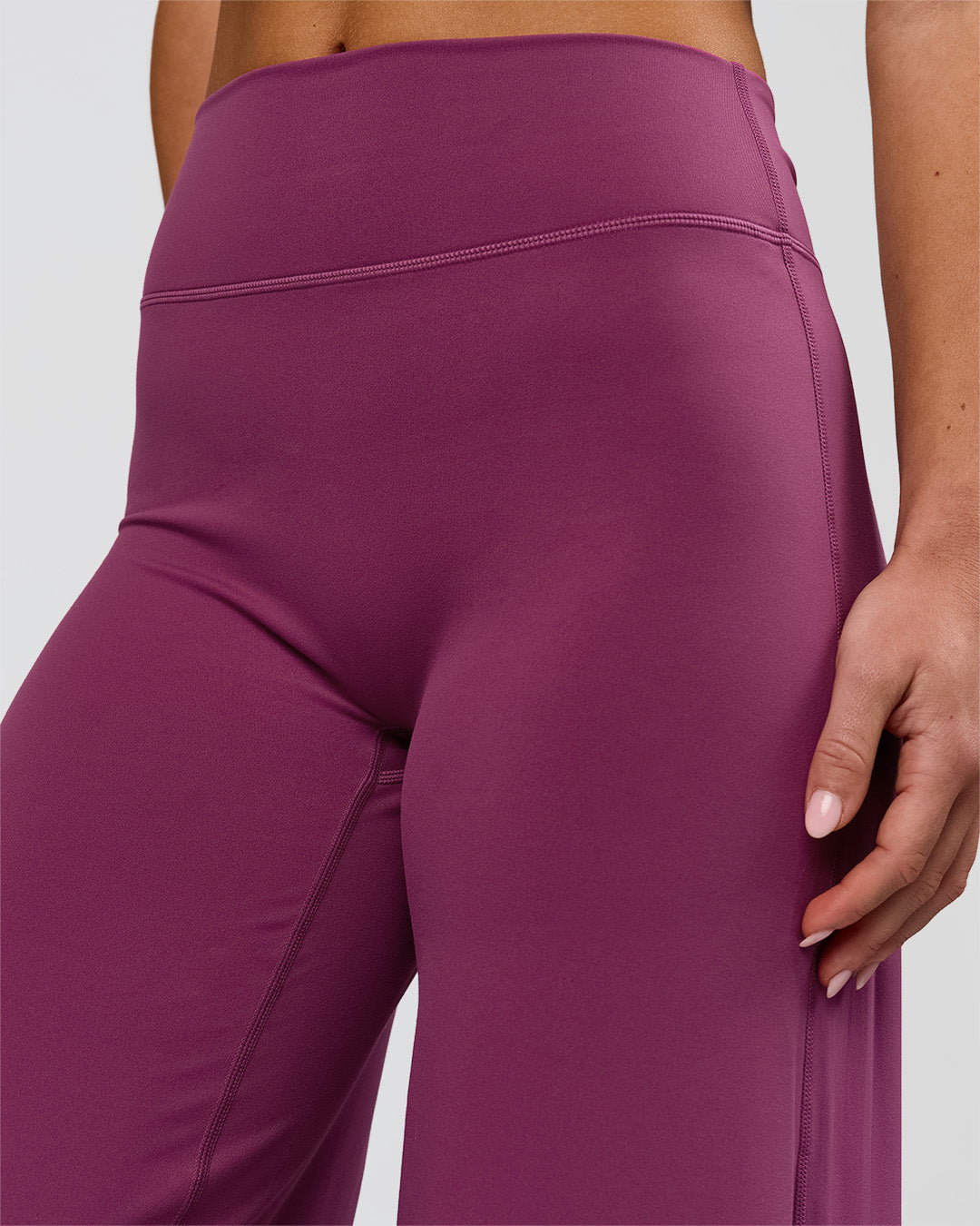Woman wearing Elixir High-Rise Petite Pant - Boysenberry | Model:Issy | Size:XS - view 14