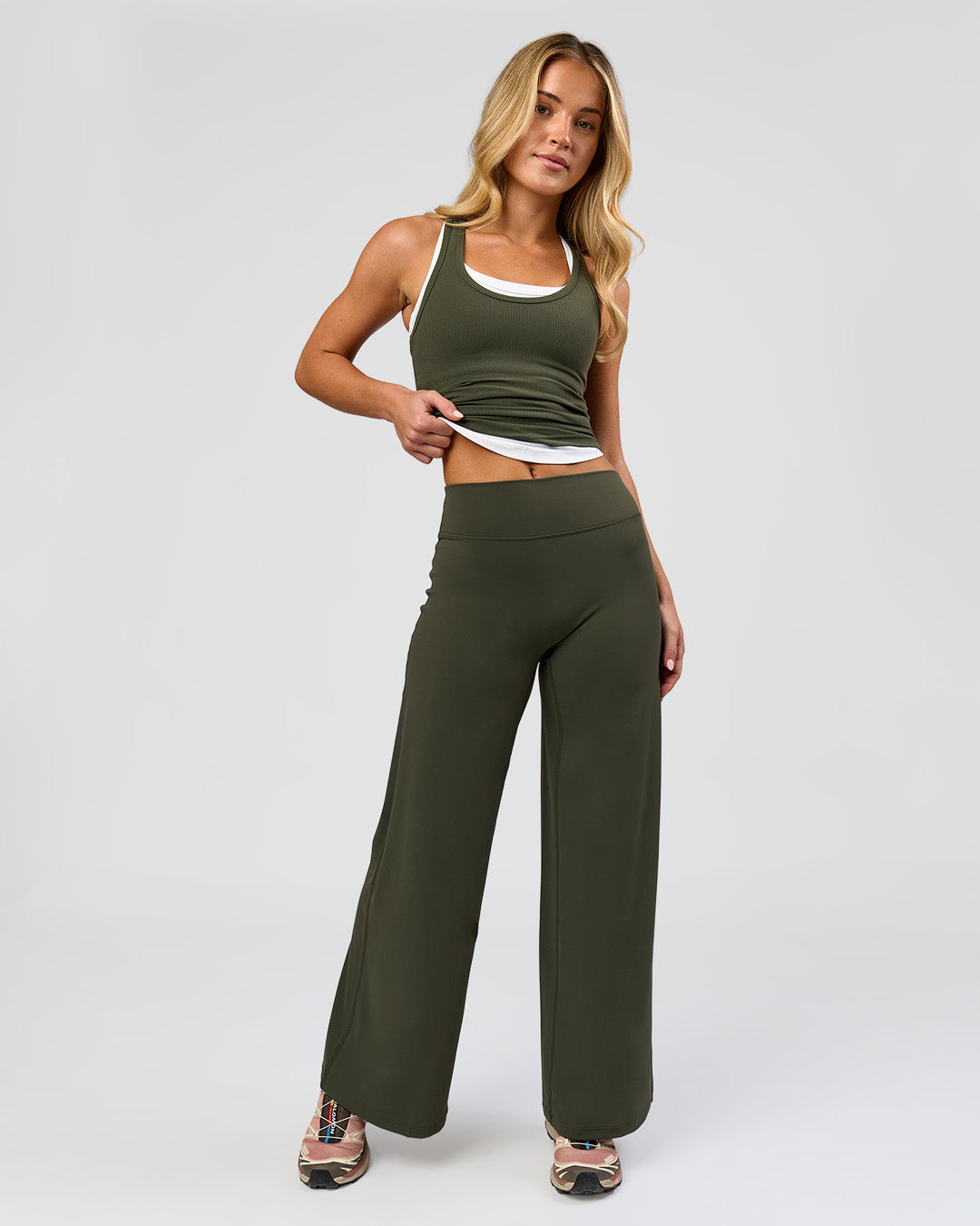 Woman wearing Elixir High-Rise Petite Pant - Pure Olive | Model:Issy | Size:XS