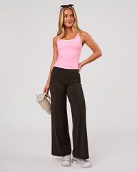 Woman wearing Elixir High-Rise Petite Pant - Ground Coffee | Model:Issy | Size:XS | Thumbnail Index: 1