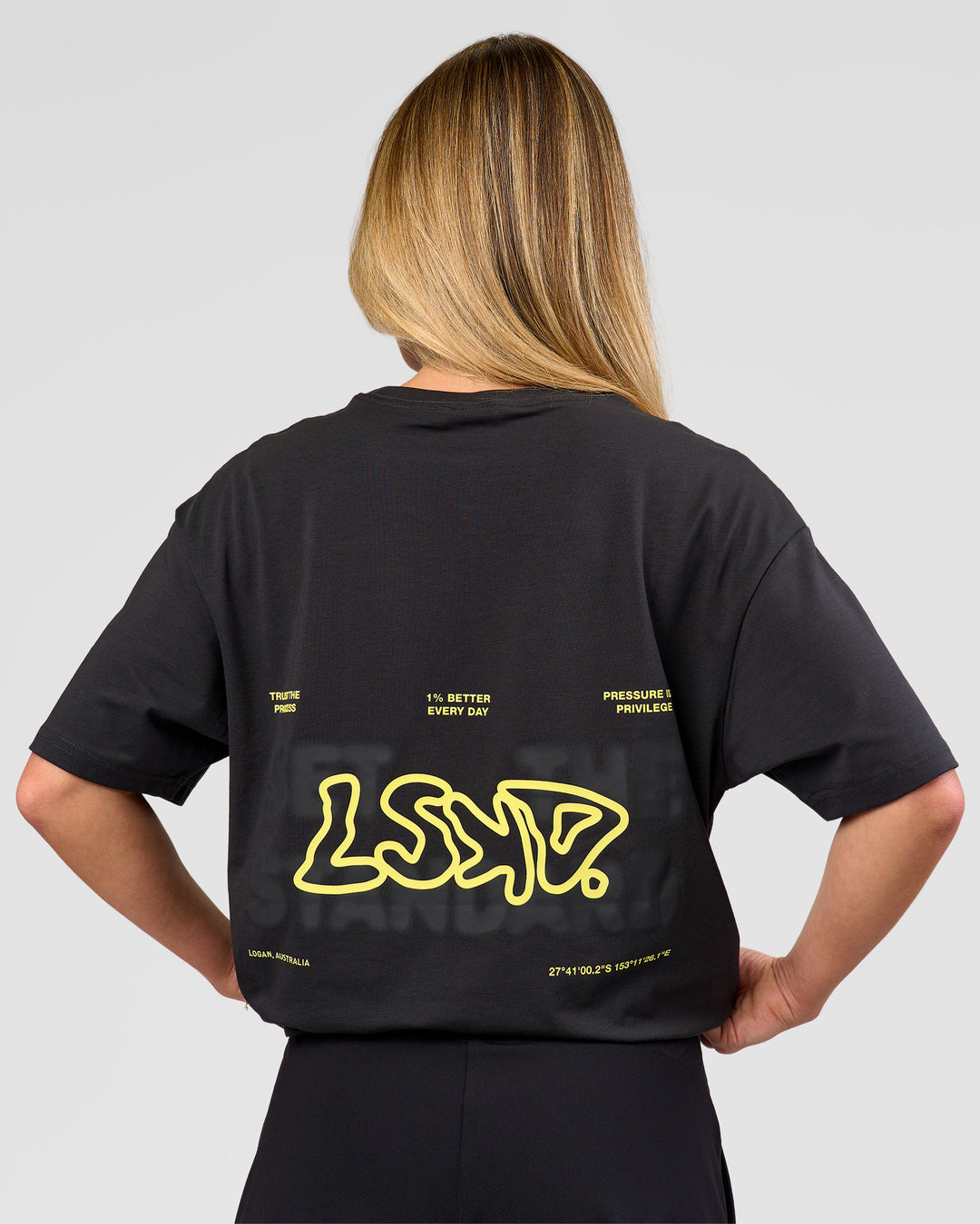 Woman wearing Benchmark FLXCotton Oversized Tee - Onyx-Yellow Fizz | Model:Issy | Size:XS - view 10