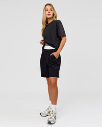 Woman wearing Benchmark FLXCotton Oversized Tee - Onyx-Yellow Fizz | Model:Issy | Size:XS | Thumbnail Index: 17