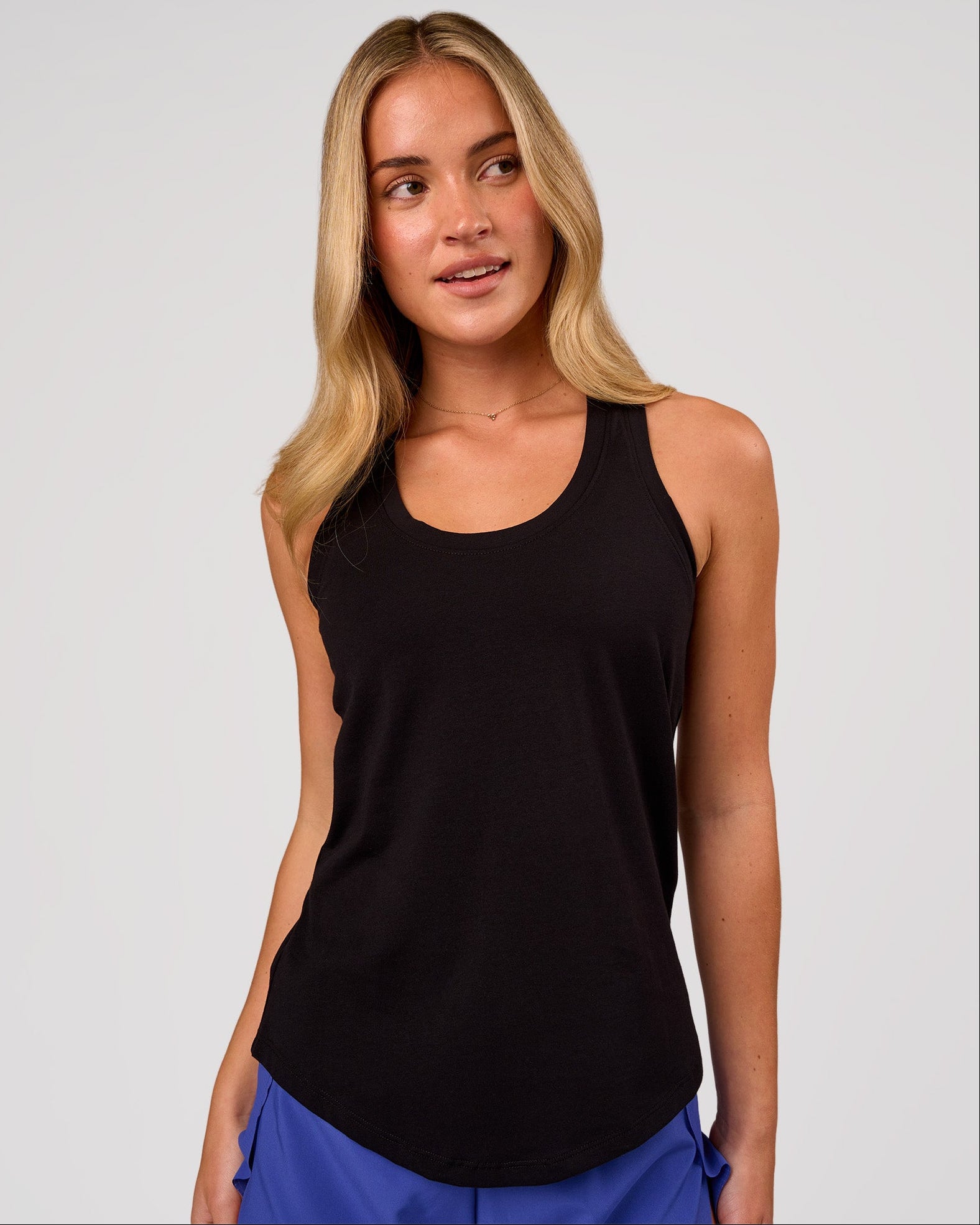 Woman wearing Force FLXCotton Longline Tank - Black | Model:Issy | Size:XS
