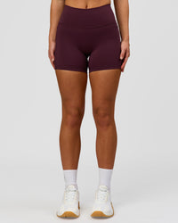 Woman wearing Fusion High-Rise 4" Short Pockets - Cherry Lacquer | Model:Issy | Size:XS | Thumbnail Index: 2