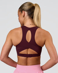 Woman wearing Fusion Sports Bra 2.0 - Cherry Lacquer | Model:Issy | Size:XS | Thumbnail Index: 1