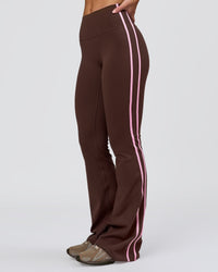 Woman wearing Fusion V-Contour Bind High-Rise Flared Legging - Hot Chocolate-Pink Rose | Model:Issy | Size:XS | Thumbnail Index: 0