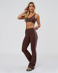 Woman wearing Fusion V-Contour Bind High-Rise Flared Legging - Hot Chocolate-Pink Rose | Model:Issy | Size:XS | Thumbnail Index: 10