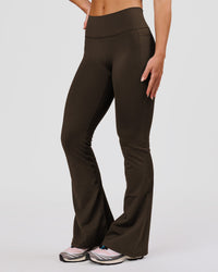 Woman wearing Fusion V-Contour High-Rise Flared Petite Legging Pockets - Ground Coffee | Model:Issy | Size:XS | Thumbnail Index: 3