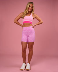 Woman wearing Fusion V-Contour Ultra High-Rise 6" Short Pockets - Energy Print Marshmallow | Model:Issy | Size:XS | Thumbnail Index: 7
