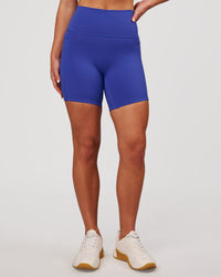 Woman wearing Fusion V-Contour Ultra High-Rise 6" Short Pockets - Power Cobalt | Model:Issy | Size:XS | Thumbnail Index: 5