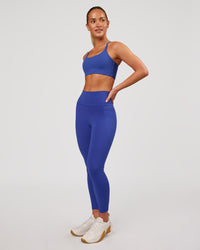 Woman wearing Fusion V-Contour Ultra High-Rise 7/8 Legging Pockets - Power Cobalt | Model:Issy | Size:XS | Thumbnail Index: 6