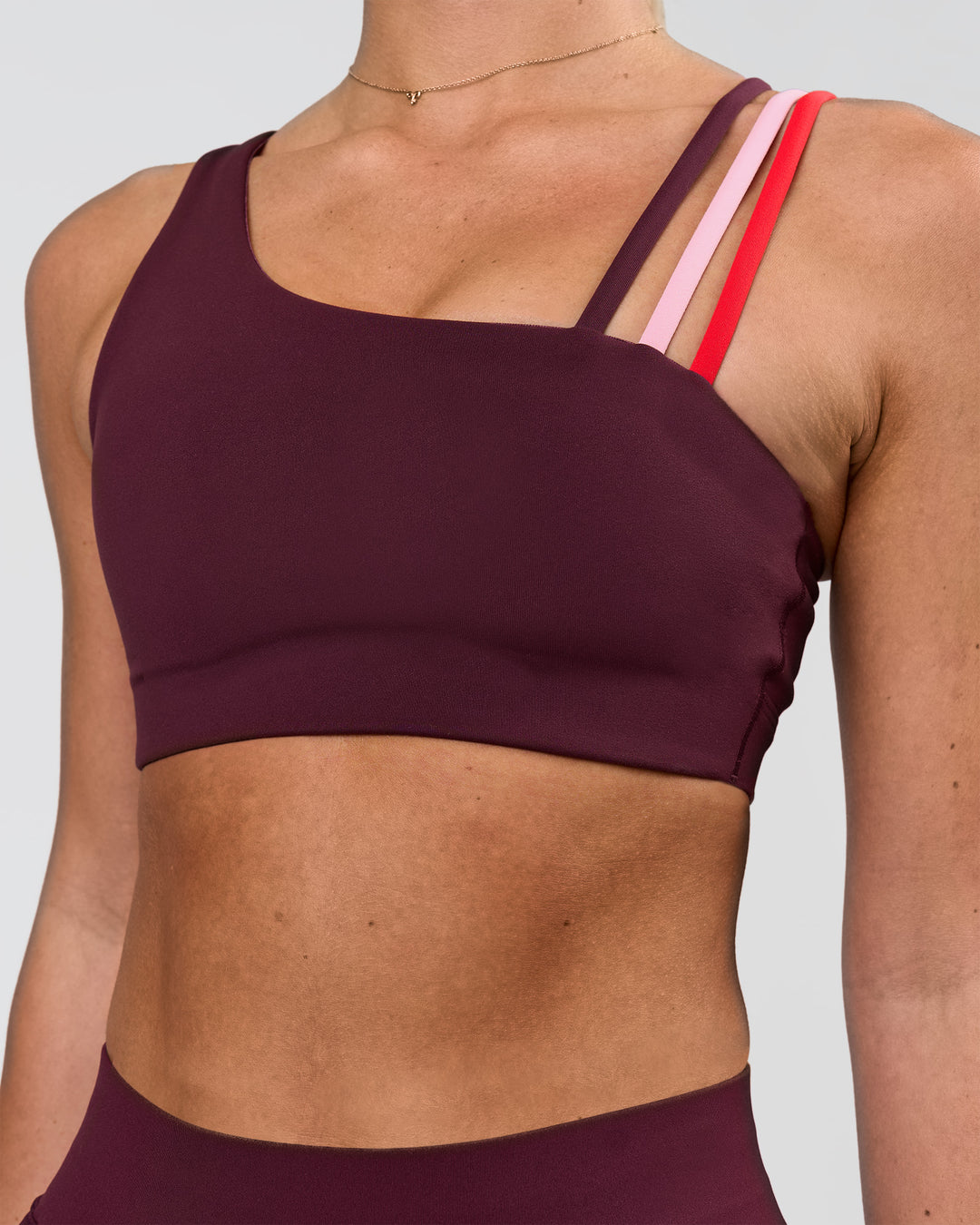 Woman wearing Galvanise Sports Bra 2.0 - Cherry Lacquer-Multi | Model:Issy | Size:XS - view 1