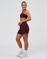 Woman wearing Galvanise Sports Bra 2.0 - Cherry Lacquer-Multi | Model:Issy | Size:XS | Thumbnail Index: 3