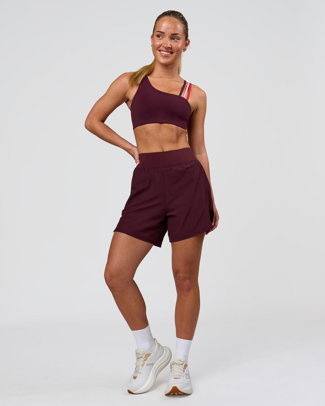 Woman wearing Galvanise Sports Bra 2.0 - Cherry Lacquer-Multi | Model:Issy | Size:XS - view 6