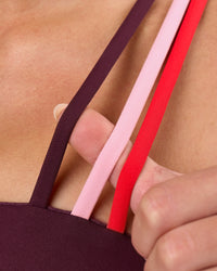 Woman wearing Galvanise Sports Bra 2.0 - Cherry Lacquer-Multi | Model:Issy | Size:XS | Thumbnail Index: 6