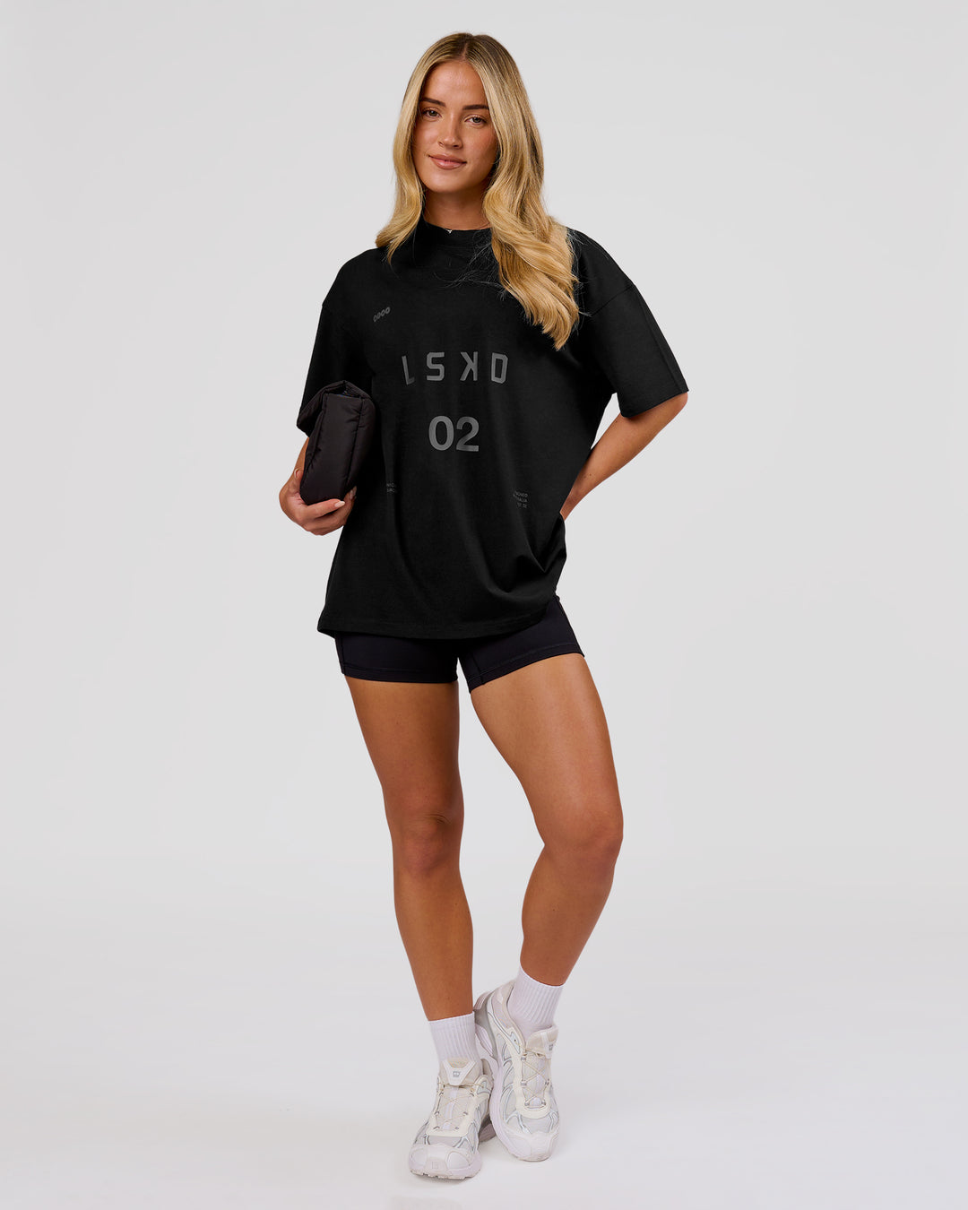 Woman wearing Game Plan Heavyweight FLXCotton Oversized Tee - Black | Model:Issy | Size:XS - view 5