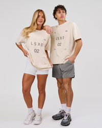 Woman wearing Game Plan Heavyweight FLXCotton Oversized Tee - Vanilla Bean | Model:Issy | Size:XS | Thumbnail Index: 12