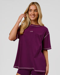 Woman wearing Go-To Contrast Oversized Heavyweight FLXCotton Tee - Plum Caspia-Pink Rose | Model:Issy | Size:XS | Thumbnail Index: 0