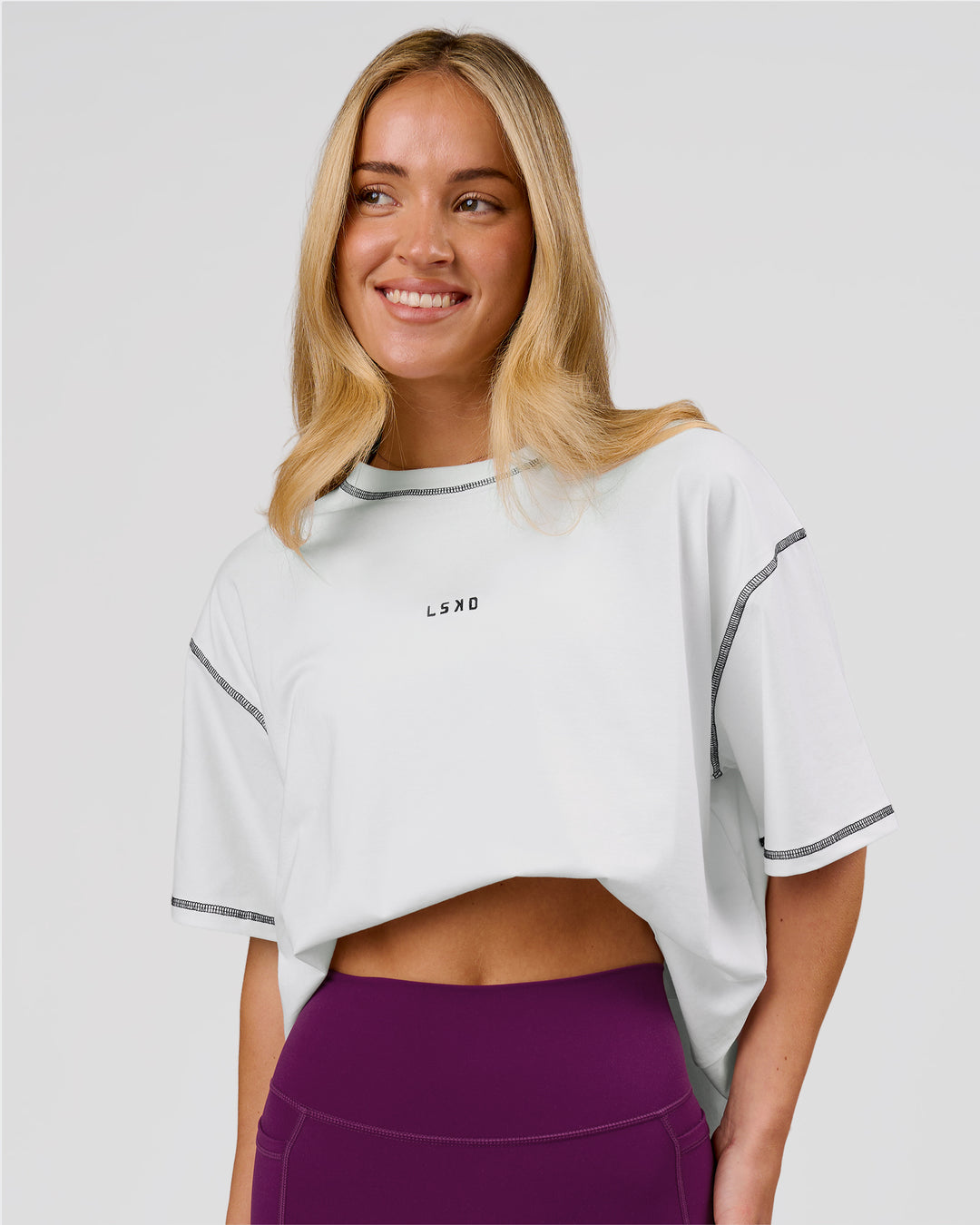 Woman wearing Go-To Contrast Oversized Heavyweight FLXCotton Tee - White-Black | Model:Issy | Size:XS - view 1