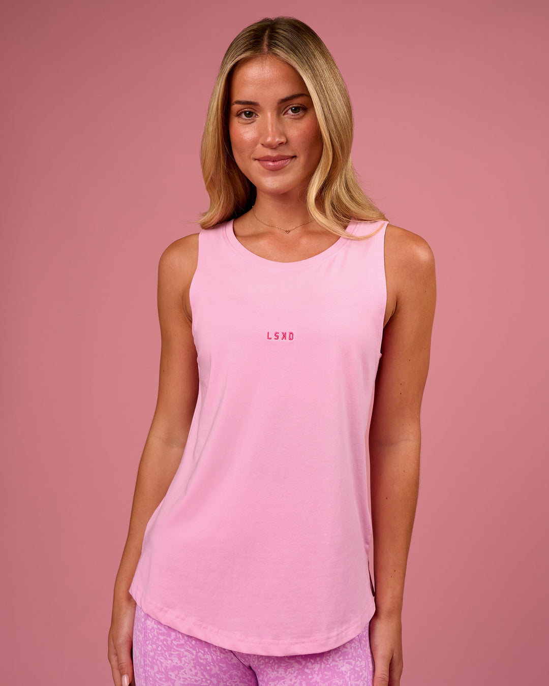 Woman wearing Go-To FLXCotton Longline Tank - Pink Rose-Ultra Pink | Model:Issy | Size:XS - view 1