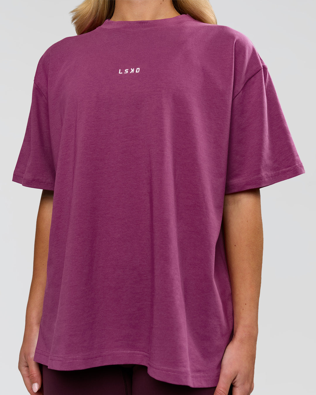 Woman wearing Go-To FLXCotton Oversized Tee - Boysenberry-White | Model:Issy | Size:XS - view 7