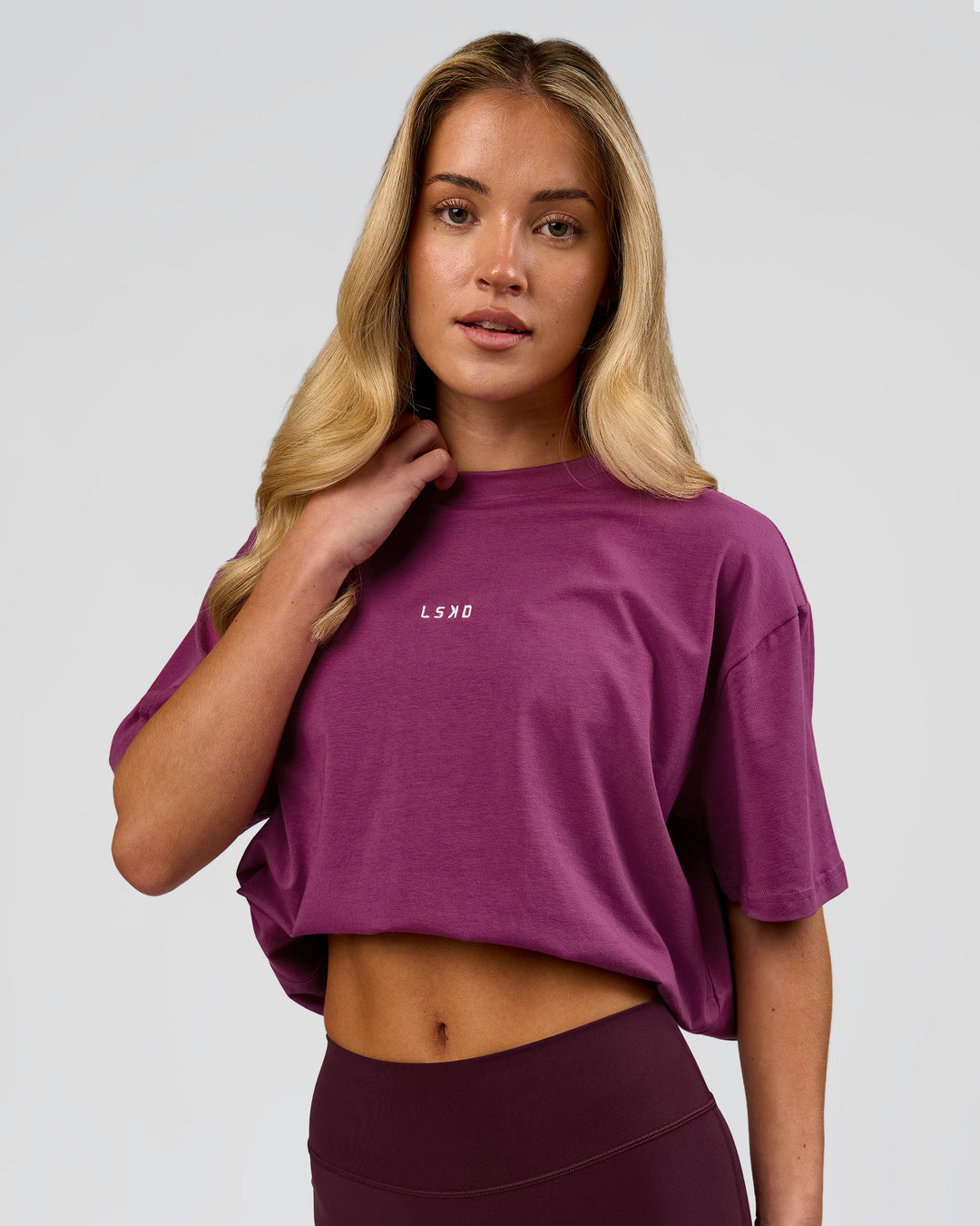 Woman wearing Go-To FLXCotton Oversized Tee - Boysenberry-White | Model:Issy | Size:XS - view 1